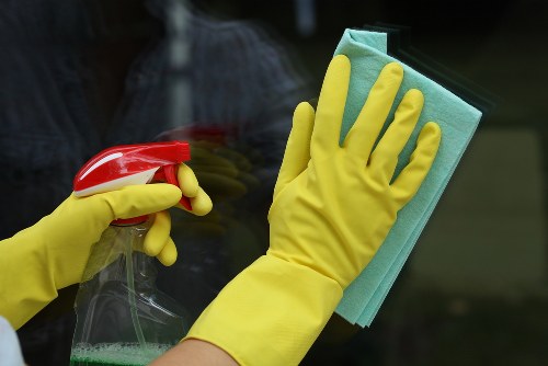 Cleaning technician preparing equipment for safe carpet cleaning